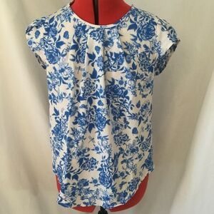Blue flowered cap sleeve blouse.